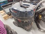 many vacuums that are on the floor in the room