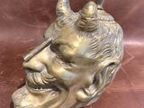 a statue of a man with two birds on his head