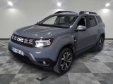 the grey dacia is parked on a checkered tile floor