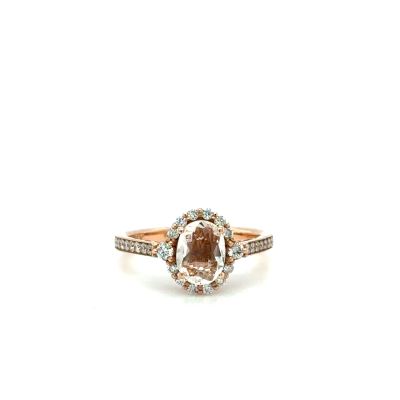 a close up of a diamond ring on a white background