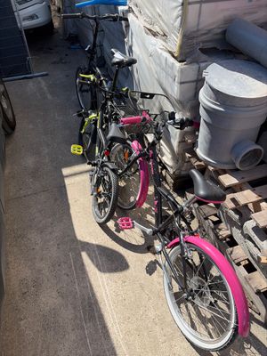 two bikes parked next to each other on a pallet
