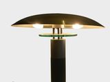 an image of a table lamp with a black base and a gold shade