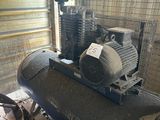 a large air compressor sitting in a building