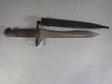a knife and a knife holder on a table
