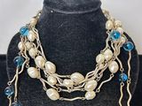 a close up of a necklace on a mannequin display