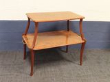 a small wooden table with a shelf on top of it
