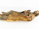 statue of a woman laying down on a pillow with a cat on her lap