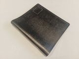 an image of a black leather notebook with a pen on it