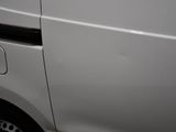 a white van that has been painted white with black trims