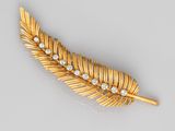 an 18k gold and diamond feather brooch