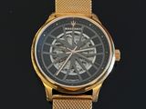 an image of a close up of a gold watch on a black surface