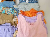 a pile of assorted clothing sitting on a table