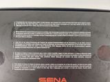 the back cover of a black laptop with a red and white logo