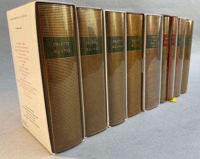 six books are lined up in a row on a table
