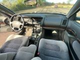 a picture of a car that is driving down the road