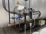 a large tank that has a bunch of pipes on it