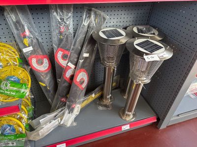 many umbrellas that are on the shelf in the store