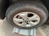 a close up of a tire on a car ' s rim