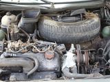 a dirty car engine with its hood open