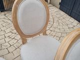 two chairs that are sitting on a brick floor