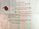 un morceau de papier portant un cachet de cire
