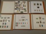 several different types of stamps are displayed on a table