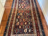 an image of a long rug on a wooden floor in a room