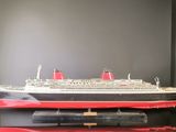 a model of a large cruise ship on a table
