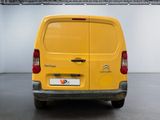 a yellow van that is parked in a garage