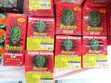 several boxes of demon soap sit on a table in front of other boxes