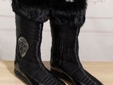 black leather boots with black fur lining and black rubber soles