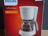 packaging of a coffee maker sitting on top of a wooden table