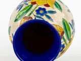 a blue vase with a floral design on it