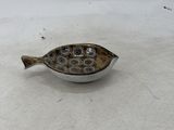 an image of a fish shaped object on a white surface
