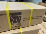 boxes stacked on top of each other on a table in a warehouse