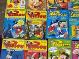 a lot of cartoon books that are on the floor