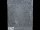 an image of a piece of slate with a sticker on it