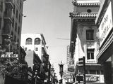 a black and white photo of a busy city street