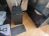 a computer on the floor next to a television