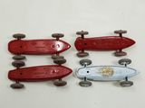 three skateboards that are sitting next to each other on a table