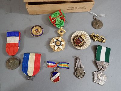 many medals and medals on display in a wooden box
