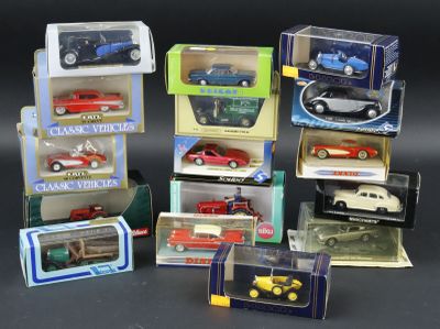 a lot of toy cars in boxes on a table