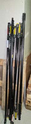 a lot of baseball bats that are sitting on the floor