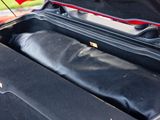 a suitcase that is open on the side of the road