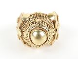 a close up of a gold ring on a white surface