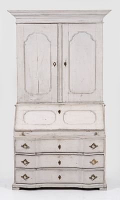an old white cabinet with drawers and drawers on top of it
