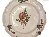 a white plate with a floral design on it