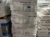 many bags of cement stacked on top of each other