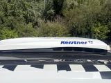 a white car with a black and white checkered roof