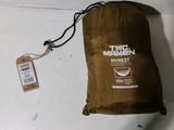 a brown bag with a tag on it sitting on a table